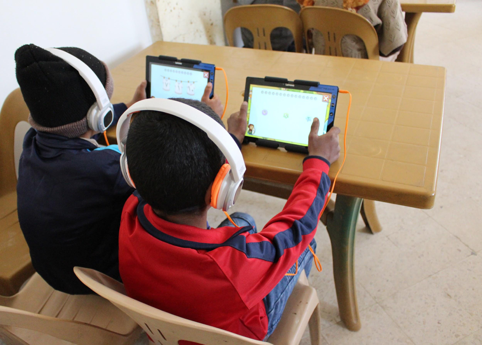 HEA grantee War Child Holland’s educational game, Can’t Wait to Learn, being used by students in a classroom in Jordan © War Child Jordan