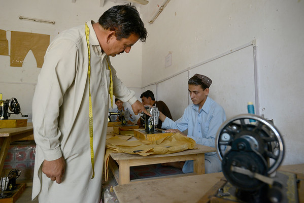 Young men attend a tailoring class at UNHCR's Technical Training Centre (TTC) for Afghan refugees in Kot Chandana refugee village in Mianwali, Pakistan UNHCRS Sebastian Rich